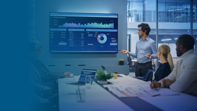 A team discussing in a meeting room > Dassault Systèmes