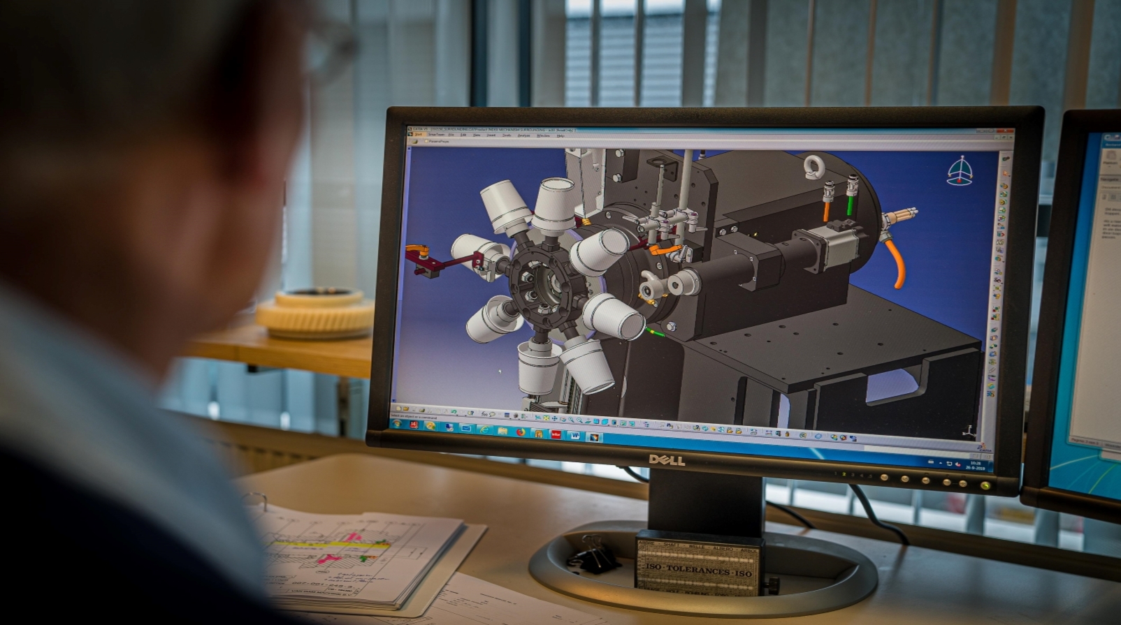 Van Dam Machine engineer designing cup printring machine part using CATIA V5 > Dassault Systemes