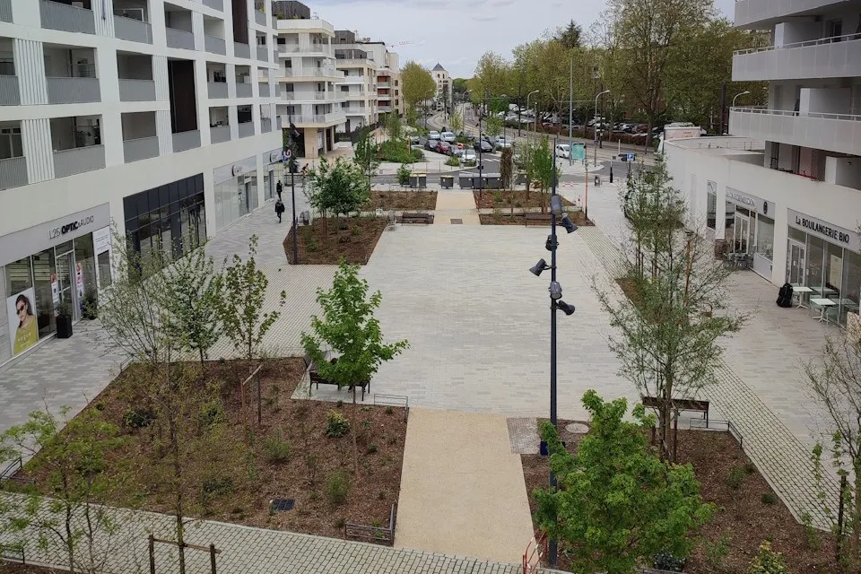 Redesigned Simone Veil Square in Meudon with added trees, shaded walkways, and green space for urban cooling and comfort > Dassault Systemes
