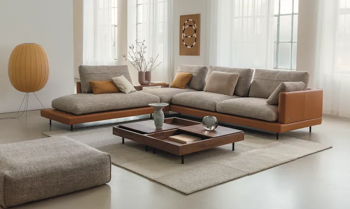 Rolf Benz modular sofa with tan leather arms and grey fabric cushions, designed using the 3DEXPERIENCE platform.