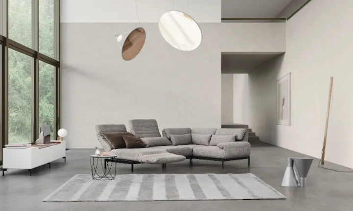 Rolf Benz modular gray sectional sofa in a minimalist living room, designed using the 3DEXPERIENCE platform.