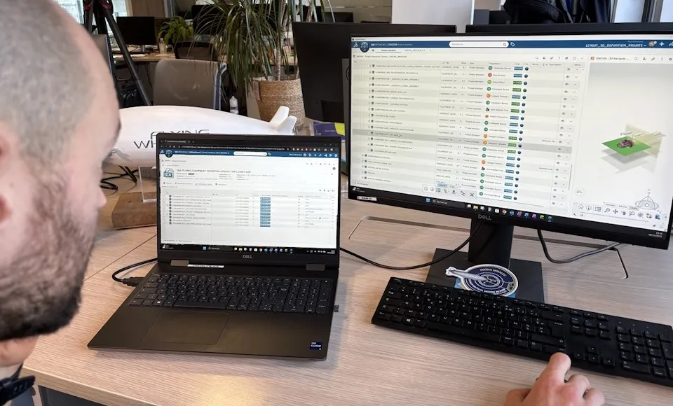 Flying Whales engineer using the 3DEXPERIENCE platform on dual Dell screens to manage airship production planning.