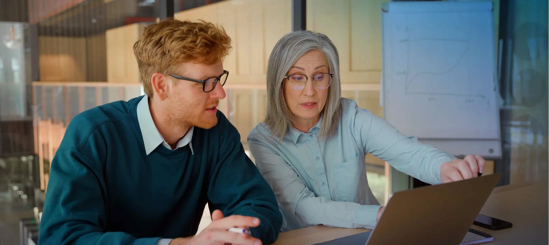 Business professionals collaborating in a modern office setting for strategic consulting and digital transformation services