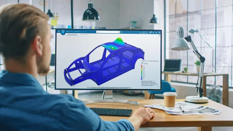 an Engineer analyzing data visualization on screen using the 3DEXPERIENCE platform for Industrial AI insights.