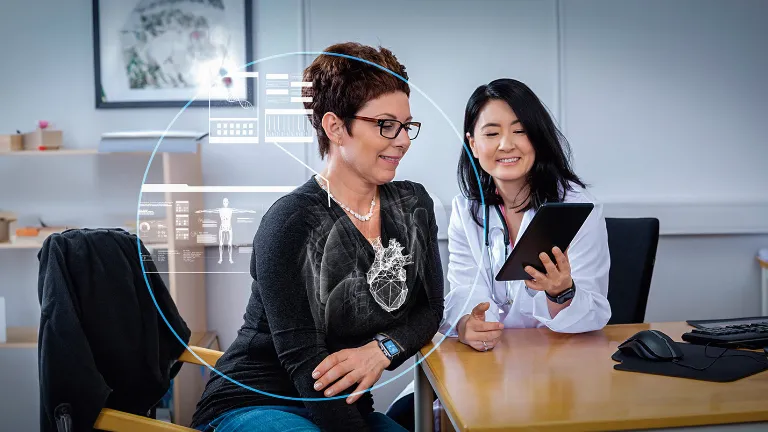 Doctor using tablet with medical data overlay, illustrating Virtual Twin applications in Life Sciences & Healthcare.