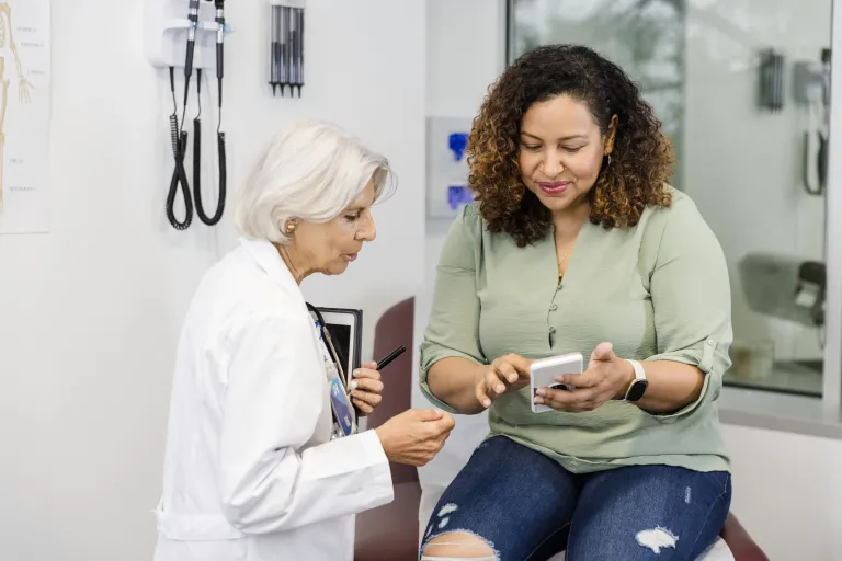 Healthcare professional consulting a patient