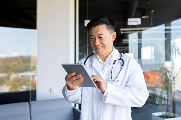 Lab tech reading clinical trial results