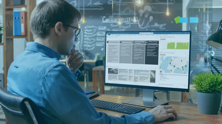Man at computer reading data