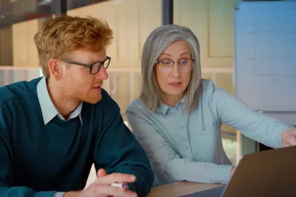Business professionals collaborating in a modern office setting for strategic consulting and digital transformation services