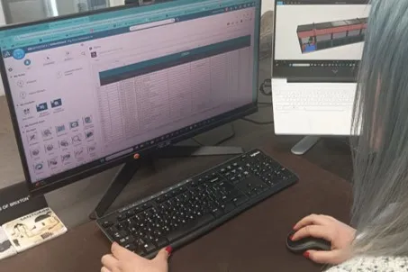 Engineer working on IGeTECH Hummingbird eVTOL charging station designed with Dassault Systèmes 3DEXPERIENCE platform.